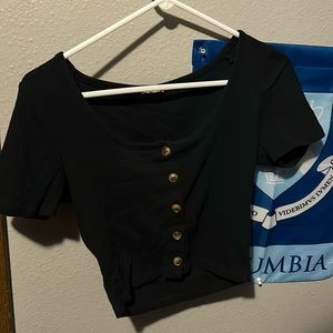 A size small tight shirt. Barely cropped and very stretchy. Never used